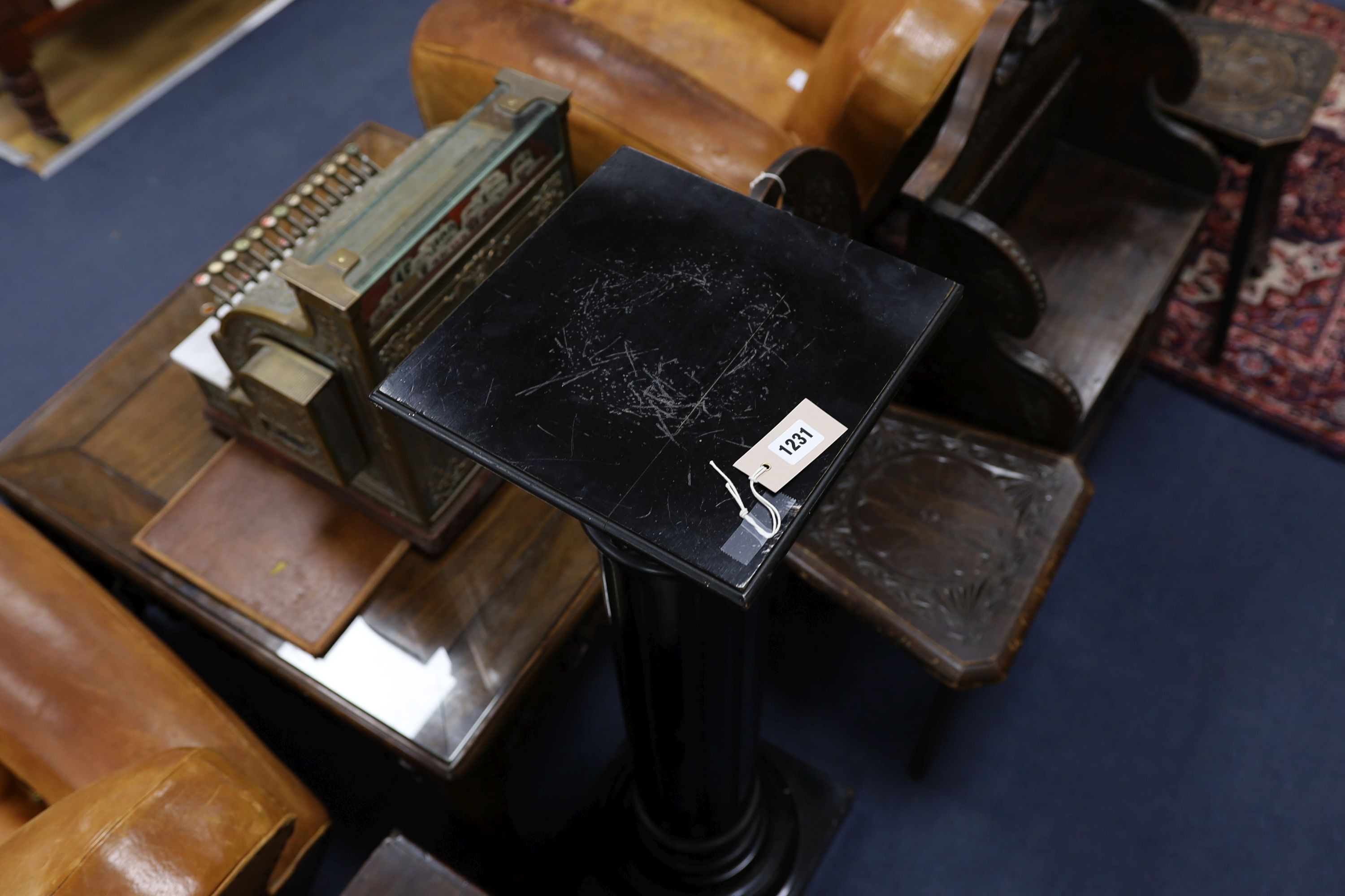 A late Victorian ebonised pedestal, height 110cm